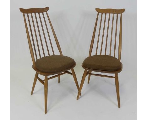 A pair of 1960s Ercol blond elm Goldsmith dining chairs, on turned tapering supports, w.42cm