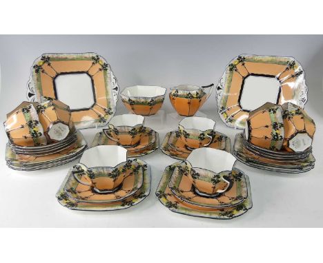 An Art Deco Shelley 'Sunset and Tall Trees' part tea service in the rare orange colourway, comprising; two sandwich plates, t