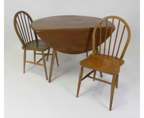 A 1960s Ercol blond elm breakfast suite, comprising dropflap table, h.72cm, length 125cm, d.112cm, five matching Ercol model 