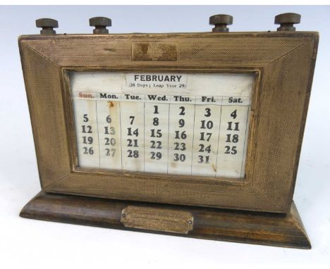 An Art Deco stained beech and silver mounted desk calendar, the engine turned silver mount by J.W. Myatt &amp; Co, Birmingham