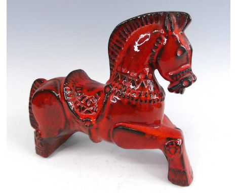 A contemporary flambé glazed ceramic model of a horse in the Eastern taste, incised decorated, unsigned, length 30cm, h.24.5c