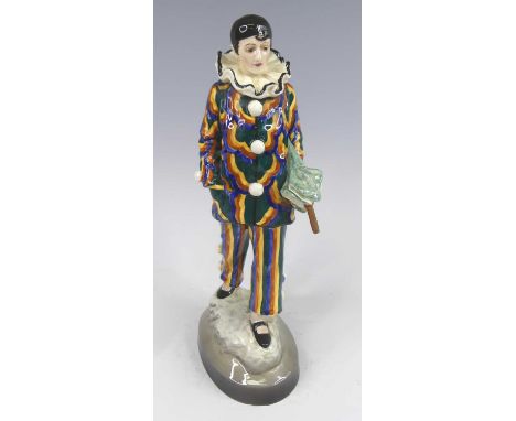 B. Haniroff for Goldscheider - a 1930s ceramic figure of the standing Pierriot holding an umbrella, underglaze bright colour 