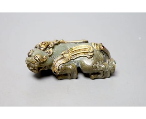   A Chinese celadon jade and gilt metal mounted figure of a Pixiu, 12cm long