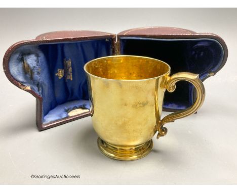   A Victorian silver gilt christening mug, by R &amp; S. Garrard &amp; Co, London, 1873, height 82mm, 7oz, in associated leat