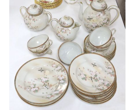   A Japanese eggshell porcelain tea service