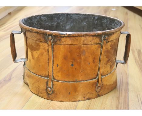   An Art Nouveau copper two handled planter, 38cm