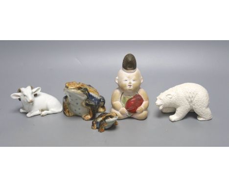   A Japanese Hirado porcelain figure of a polar bear, a Japanese porcelain figure of a ram, two figures of toads and a doll f