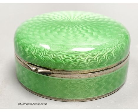   A 1920's continental silver and green guilloche enamel circular box and cover, with mirrored interior, import marks for P.H