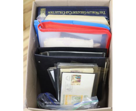   A collection of stamps and coins, including first day covers,