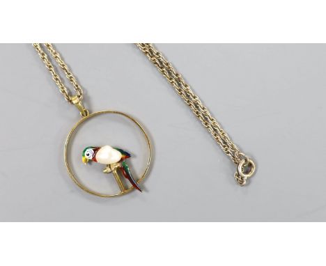   An early 20th century 15ct, enamel and baroque pearl set open work circular pendant, 22mm, gross 2.4 grams, on a later ster