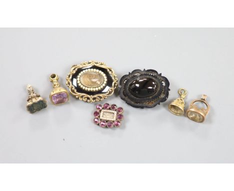   A Victorian yellow metal overlaid and bloodstone set fob seal, 24mm, three other fob seals, one with vacant matrix and thre