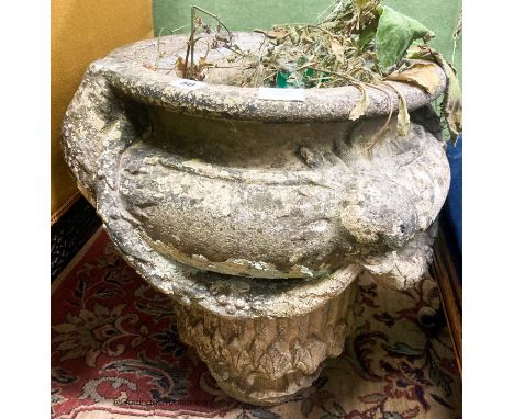   A reconstituted stone garden planter, diameter 50cm H.54cm