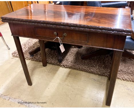   A George III rectangular mahogany concertina card table, W.93cm D.46cm H.76cm