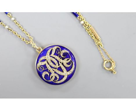   A yellow metal, blue enamel and rose cut diamond set monogrammed circular locket (a.f.) 29mm, on a 9k, seed pearl and blue 