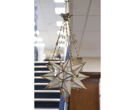   A gilt-metal star-shaped ceiling light, having etched plain glass panels and chain suspension, height 80cm
