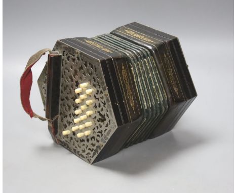   A Victorian 36 button concertina, with pierced nickel mounts, unsigned