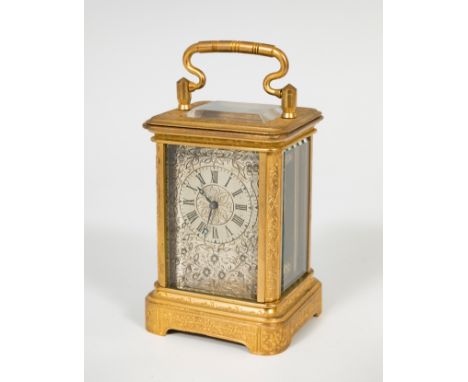 Carriage clock; late 19th century.Gilt bronze.8 days winding.Aiguilles movement.Needs restoration.Measurements: 9,3 x 5,3 cm.