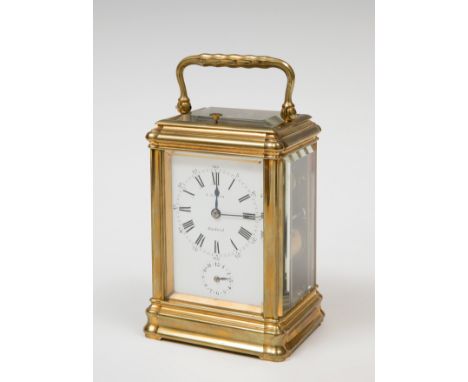 Travel clock; "R.Garin. Madrid, 19th century.Bronze and bevelled glass.Preserves key.Measurements: 14,8 x 7 cm.Travel or carr