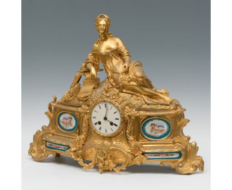 Table clock; Napoleon III, ca. 1870.Gilt bronze and porcelain plates.No key.Paris movement.Needs to be tuned.Measures: 43 x 5