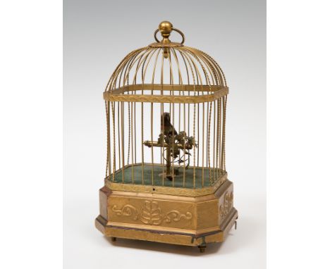 Cage with bird; late 19th century.Bronze, feathers, stuccoed wood and brass.In need of restoration and fine-tuning.Measuremen