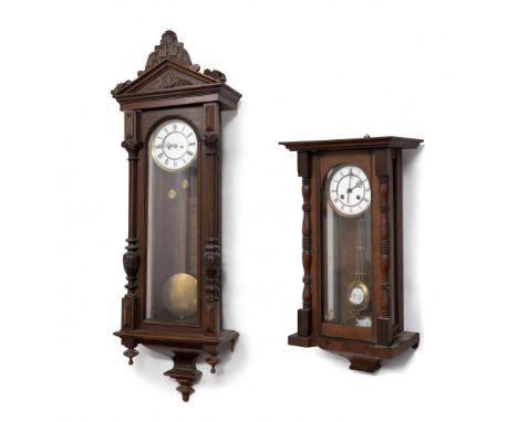 Set of two Alfonsinos clocks; late 19th century.Carved wood.No key preserved.In need of repair.They show xylophagous damage a