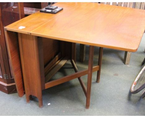 A vintage teak folding gate table by McIntosh