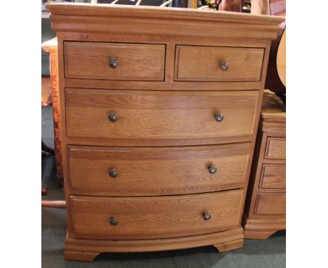 A modern light oak bow fronted chest of two over three drawers, 80cm wide x 100cm high, x 52cm deep (centre of bow) Condition