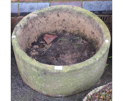 A substantial circular cast garden planter