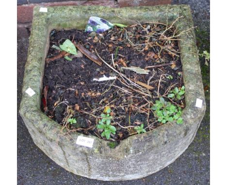 A cast garden trough planter