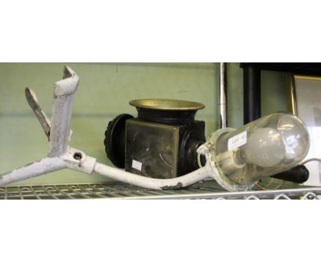 An industrial style corner cast lamp with a converted carriage lamp