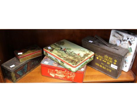 A military ammunition case with a selection of vintage pictorial tins