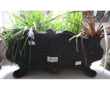 A steel planter with serpentine rim