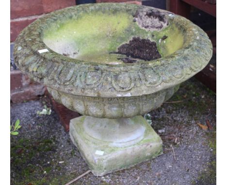 A cast garden circular planter on stand