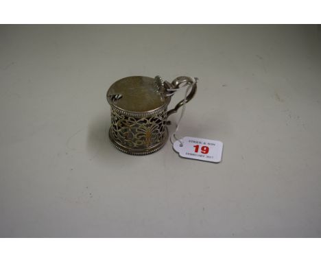 A silver mustard pot, by Holland Aldwinckle & Slater, London, having pierced decoration, 6cm, 104g.   Condition Report:  no l