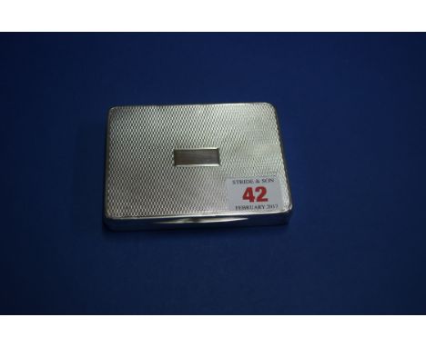 An engine turned silver cigarette case, by W T T & Co, Birmingham 1945, 10.5cm, 204g.