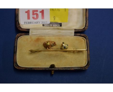 A 15ct gold, platinum and enamel bar brooch, decorated chick peering into broken eggshell, 5.5cm.