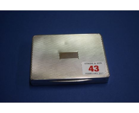 An engine turned silver cigarette case, by W T T & Co, Birmingham 1945, 10.5cm, 193g.