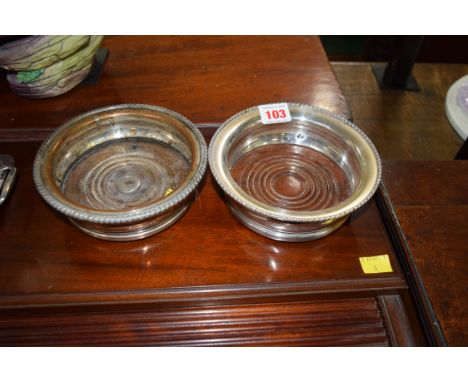 Two silver plated decanter coasters.