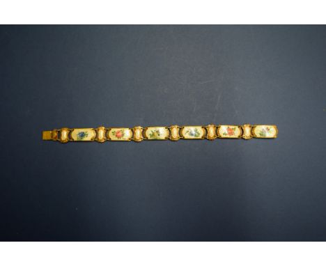 A Continental .830 silver gilt and coloured enamel bracelet, having six floral guilloche enamel panels, stamped H, 18cm.