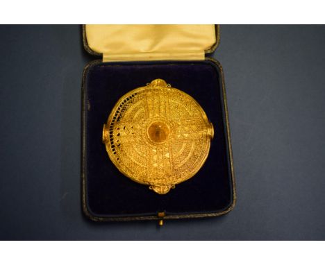 A silver gilt Ashanti shield brooch, 76mm (a f).