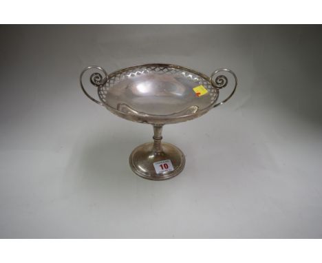 A silver twin handled tazza, Sheffield 1911, having pierced decoration to bowl, 394g, 15cm high to bowl rim.   Condition Repo