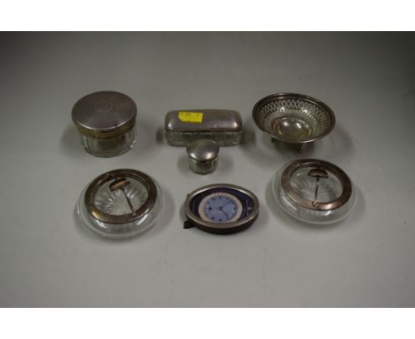 A pair of silver mounted glass ashtrays; together with three silver lidded glass jars, a small oval photograph frame and a bo