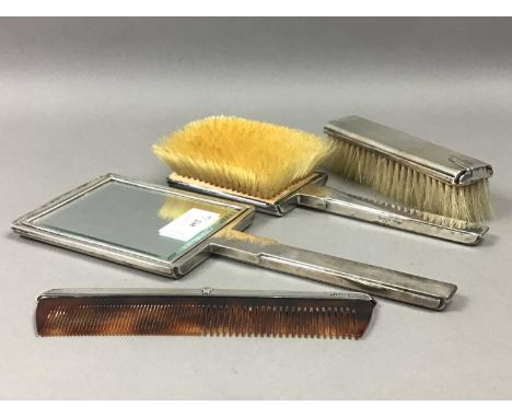 ART DECO SILVER VANITY SET,comprising a hand mirror, two brushes and a comb (4)
