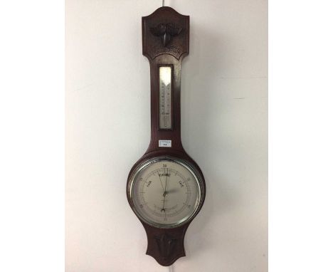 WHEEL BAROMETER WITH THERMOMETER,in a carved mahogany case