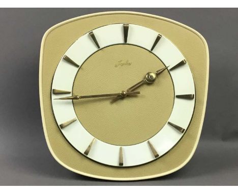 1950S/60S JUNGHANS WALL CLOCK OF ART DECO DESIGN,20.5cm wide, with twin weights and pendulum, along with an ajustable table l