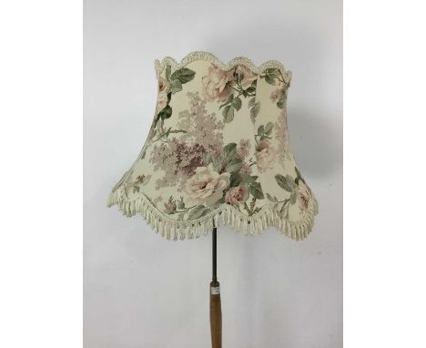 TEAK AND BRASS LACQUERED STANDARD LAMP,with floral fringed shade, 158cm high