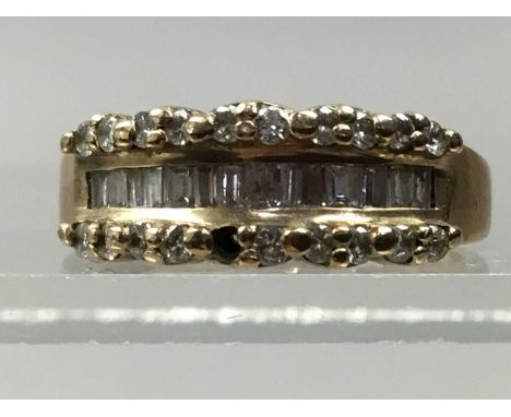 NINE CARAT GOLD RING,set with diamond chips, along with an oval pendant (2)