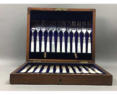 FOUR SILVER NAPKIN RINGS,along with a plated napkin ring, also a set of twelve mother of pearl handled fruit knives and forks