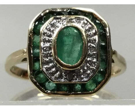 NINE CARAT GOLD RING,of Art Deco design, set with emerald and diamond chips