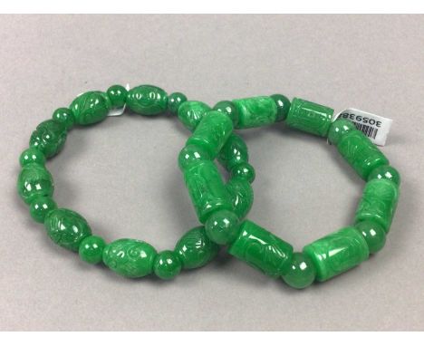 TWO JADE BRACELETS AND TWO NECKLACES,one formed by tubular and round beads, the other with oval and round beads, along with a